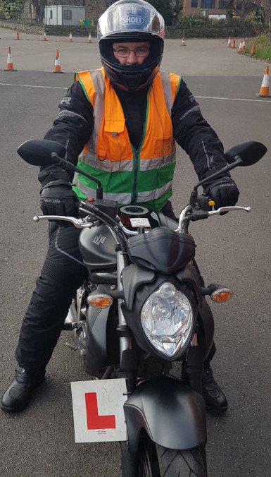 Sat on motorbike after passing mod2 motorbike test The author sat on the motorbike ridden in mod2 test for motorbike licence
